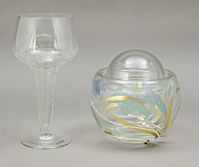 A footed glass and a lidded ja