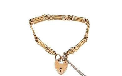 A gate link bracelet, five bar links with a heart shaped padlock clasp and integrated safety chain