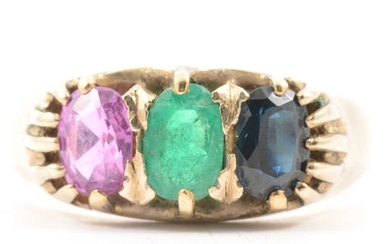 A gemstone ring set ring, emerald, sapphire and pink sapphire.