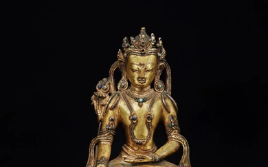 A gilt-copper alloy figure of Ratnasambhava, Tibet, 14th / 15th century
