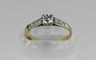 A gold and platinum diamond ring