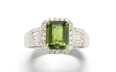 A green sapphire, diamond and platinum ring