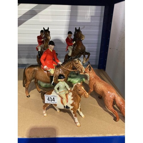 A group of Beswick huntsmen and a fox, two rearing horses (5...