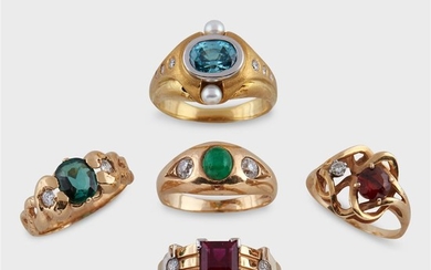 A group of gem-set fourteen karat gold rings including...