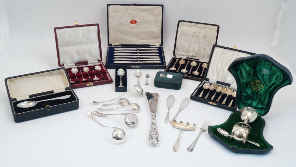 A group of silver, mostly comprising flatware, to include: an associated christening set with egg cup, napkin ring, and teaspoon, the egg cup and napkin ring by The Alexander Clark Manufacturing Co, Birmingham, 1906 and Chester, 1906, the teaspoon...