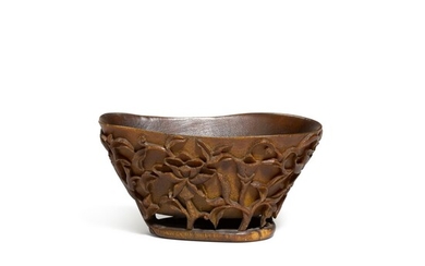 A horn libation cup, Qing dynasty, 18th century | 清十八世紀 角雕穿花螭龍紋盃