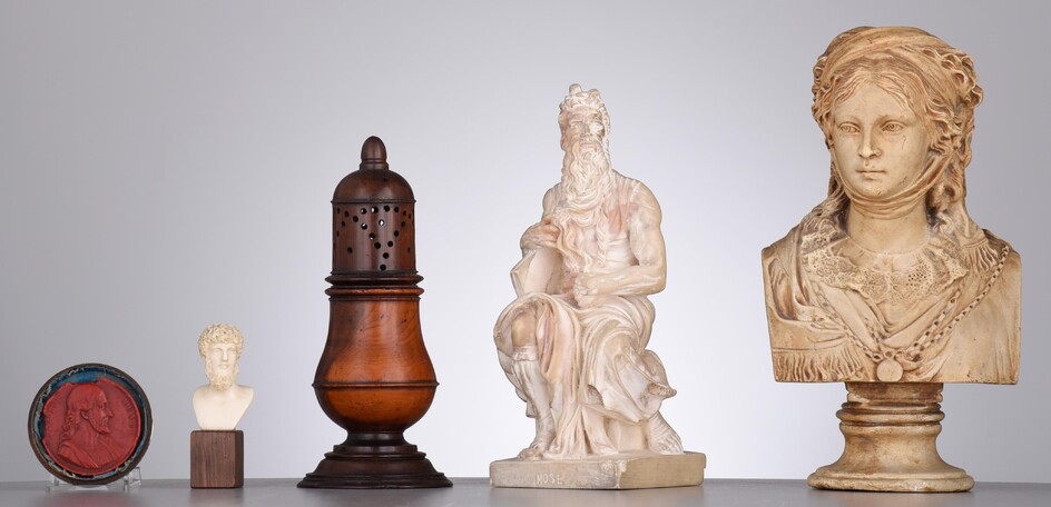 A interesting collection of various antique items, containing three sculptures, a caster and a wax seal