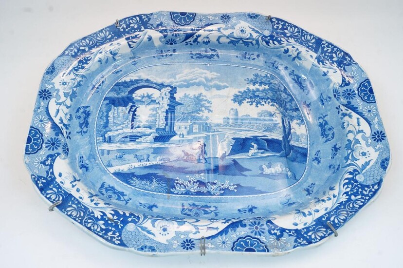 A large Victorian Spode blue and white meat plate, with transfer printed scene of a European Classical landscape, with foliate decoration to the rim, impressed mark 'Spode A' to the underside, 58.5cm x 46cm
