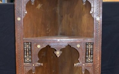 A large carved wood Moorish corner display cabinet inlaid with mother of pearl 185 x 71 x 47 cm.