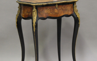 A late 19th century French kingwood and ebonized work table with foliate inlaid decoration, the hing