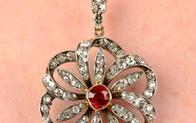 A late Victorian silver and gold, ruby and diamond floral cluster pendant.