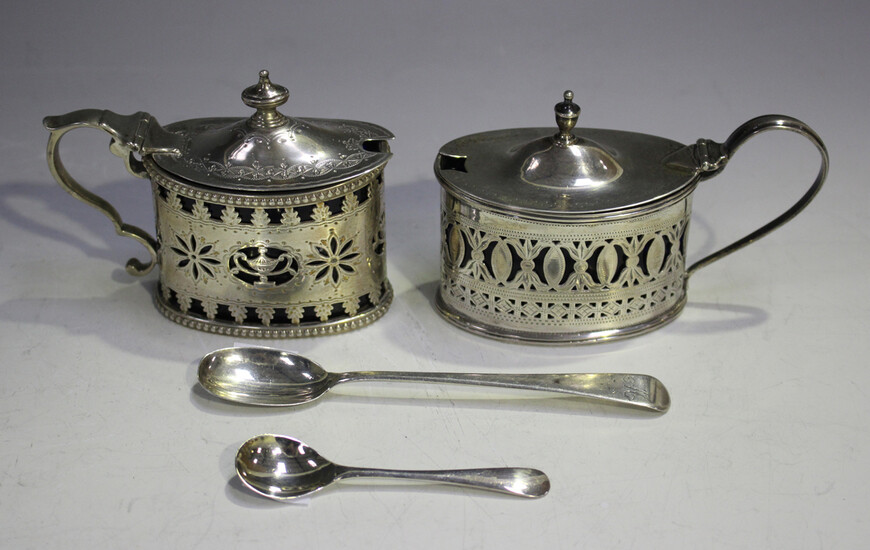 A late Victorian silver oval mustard, the engraved tapering hinged lid with urn finial above pierced