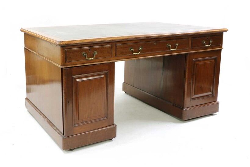A mahogany partner's desk