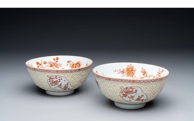 A pair of Chinese iron-red-decorated and gilt bowls with rel...