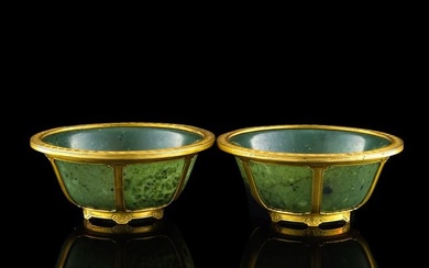 A pair of Chinese spinach jade bowls, 18th century