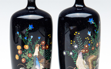 A pair of Japanese fine cloisonne vases featuring birds among...