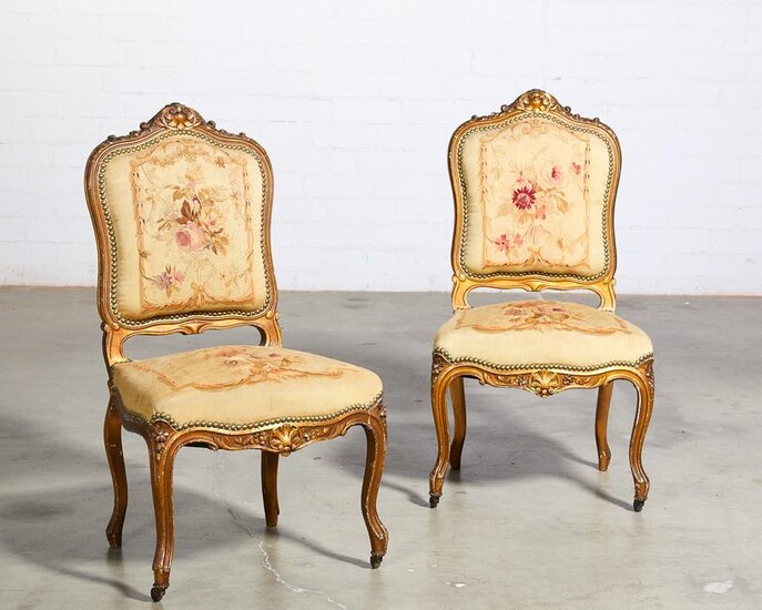 A pair of Louis XV style giltwood side chairs