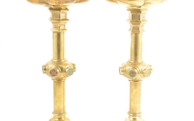 A pair of Victorian Gothic Revival brass altar candlesticks, probably to a design by A.W.N. Pugin