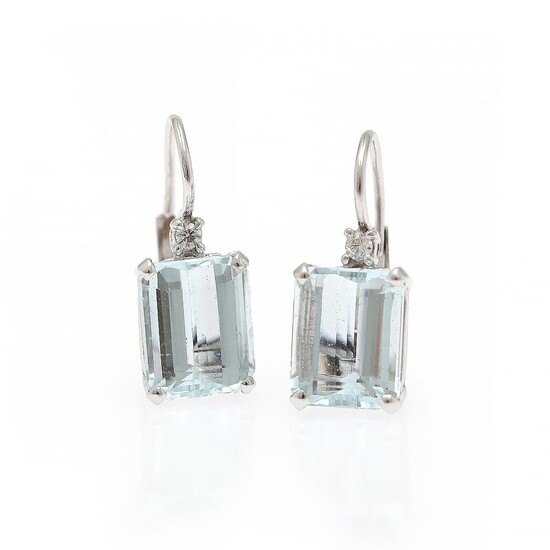 A pair of aquamarine and diamond ear pendants each set with an emerald-cut aquamarine and a diamond, mounted in 18k white gold. (2)