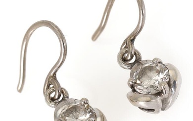 A pair of diamond ear pendants each set with a brilliant-cut diamonds...
