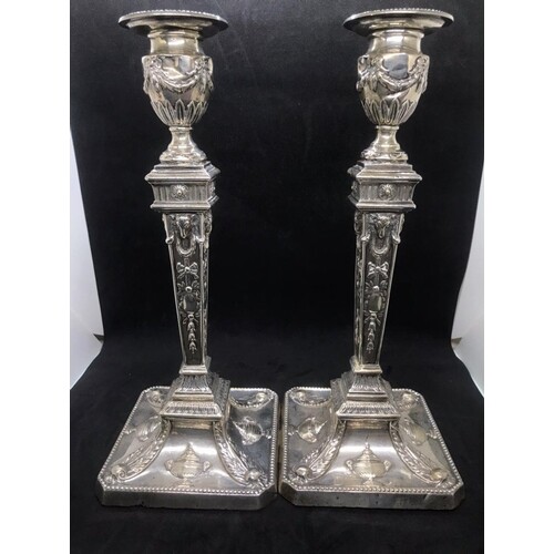 A pair of early George V sterling solid silver mounted candl...