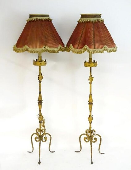 A pair of late 19th / early 20thC wrought iron standard