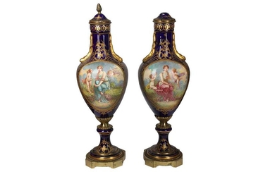 A pair of late 19th/early 20th century French Sevres style porcelain and gilt metal mounted vases