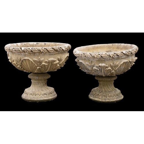 A pair of reconstituted stone circular garden pedestal urns:...