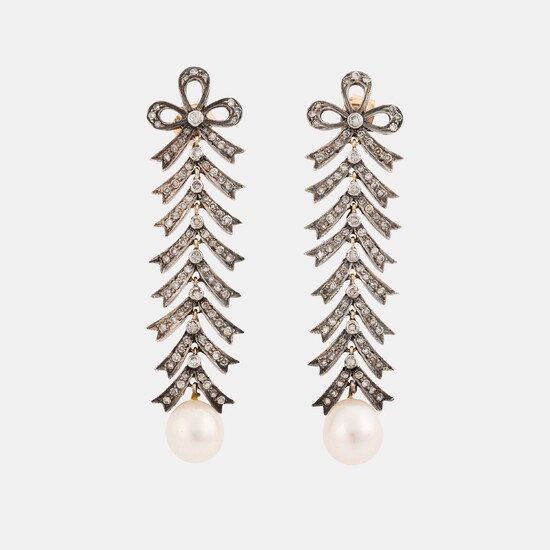 A pair of silver and 18K gold earrings with cultured pearls and set with eight-cut diamonds