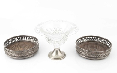 A pair of silver bottle coasters, with pierced decoration and...