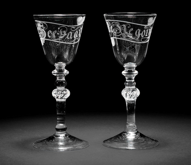 A rare pair of Dutch engraved light baluster wine glasses, circa 1760