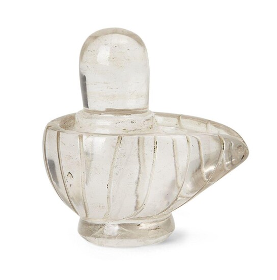 A rock crystal yoni-lingam, India, circa 19th century, carved with the lingam seated within the yoni, the yoni with a series of vertical lines carved around the base, 6cm. high x 6cm. diam.