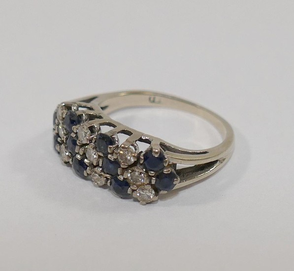 A sapphire and diamond dress ring, the nine small round bril...