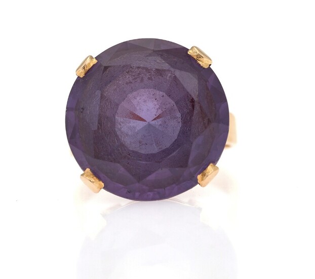 SOLD. A sapphire ring set with a circular-cut synthetic sapphire, mounted in 18k gold. Size...