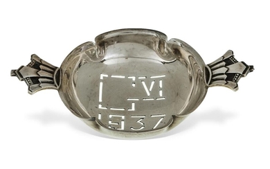 A silver strainer by Robert Edgar Stone, London, 1936, commemorating the coronation of George VI in 1937, the handles designed as crowns and the base pierced to read 'G VI 1937', 12.5cm wide (inc. handles), approx. weight 2.2oz