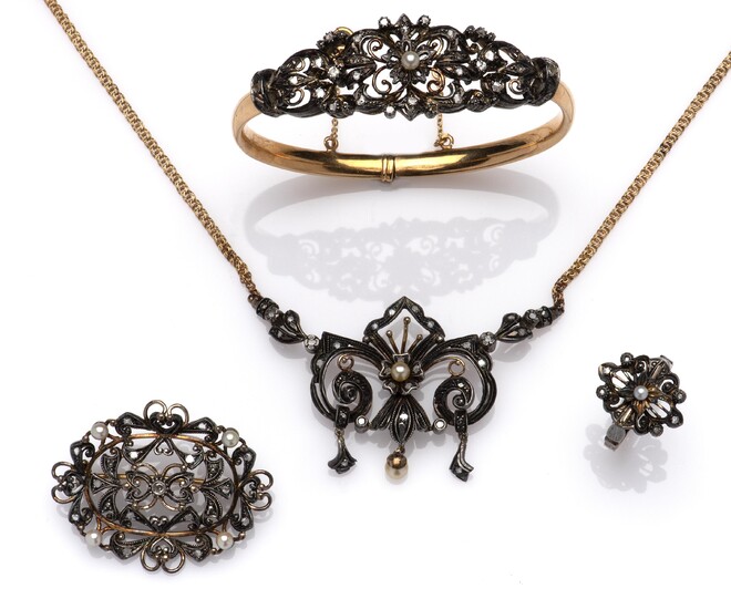 A suite of 18k gold and silver diamond jewels