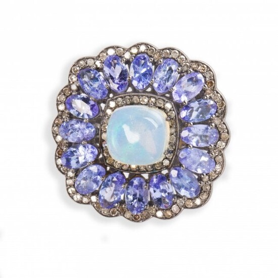A synthetic opal, tanzanite and blackened silver ring