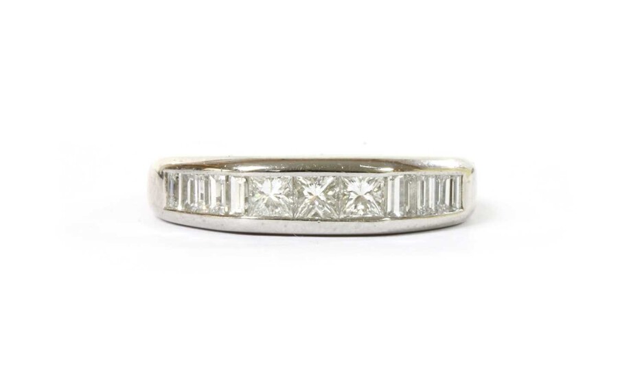 A white gold diamond half eternity ring