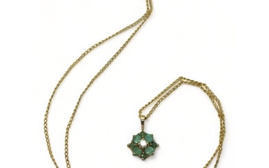 A yellow metal emerald and diamond flower pendant on a 9ct g...