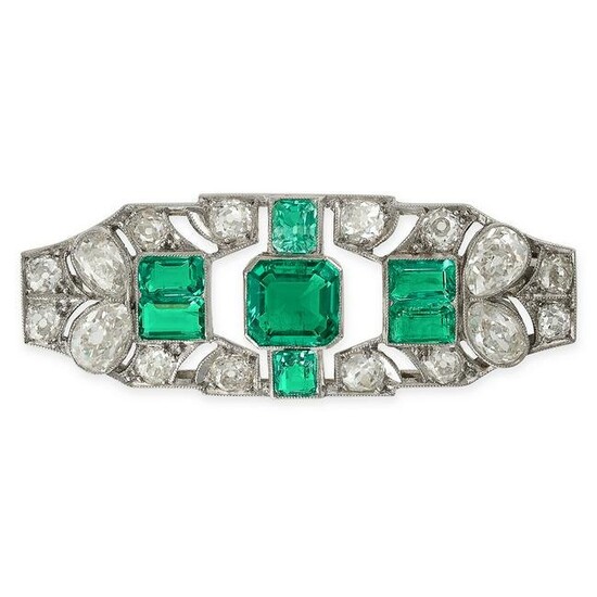 AN ART DECO COLOMBIAN EMERALD AND DIAMOND BROOCH in platinum, set with an octagonal step cut