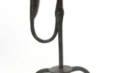 AN EARLY 18th CENTURY RUSHLIGHT ON TRIPOD BASE wit