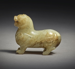 AN EXCEPTIONALLY RARE BEIGE JADE CARVING OF A MYTHICAL BEAST HAN DYNASTY - SIX DYNASTIES