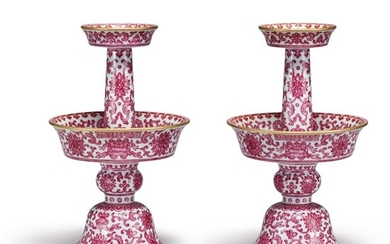 AN EXTREMELY RARE PAIR OF PUCE-ENAMELED 'BAJIXIANG' CANDLESTICKS, QIANLONG SEAL MARKS AND PERIOD