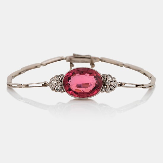An 18K gold bracelet set with a faceted pink tourmaline weight ca 6.00 cts