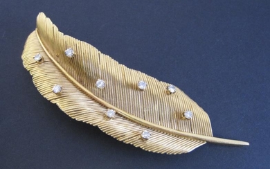 An 18ct gold Diamond Feather Brooch, decorated with claw-set...