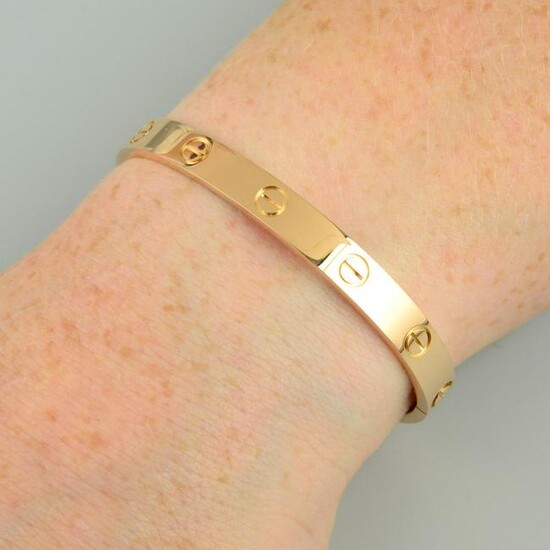 An 18ct gold 'Love' bangle, by Cartier.Swiss convention