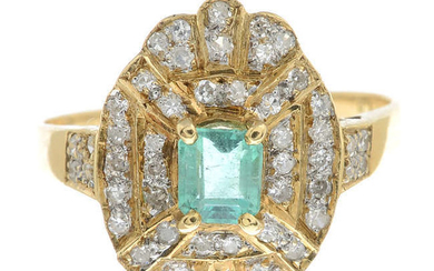 An 18ct gold diamond and emerald dress ring.
