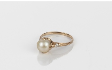 An 18ct yellow gold and cultured pearl ring - stamped 'K18',...