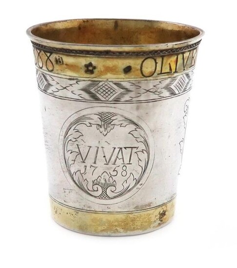 An 18th century continental parcel-gilt silver beaker, marks unidentified, possibly Scandinavian, circa 1758, tapering circular form, gilded upper and lower border, engraved with an armorial and initials, the reverse inscribed ~VIVAT 1758~, with a...