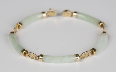 An Asian 14ct gold mounted jade bracelet, the five curved baton shaped links alternating with charac